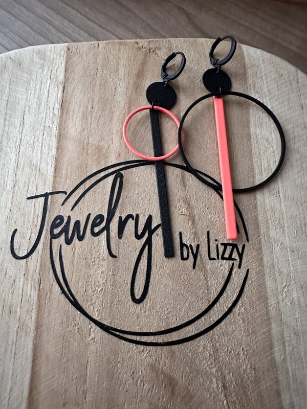 assymetrische oorbel rond lang