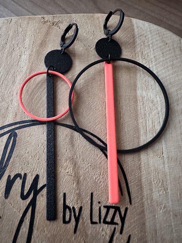 assymetrische oorbel rond lang